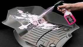 Cleaner spraying on WeatherTech mats